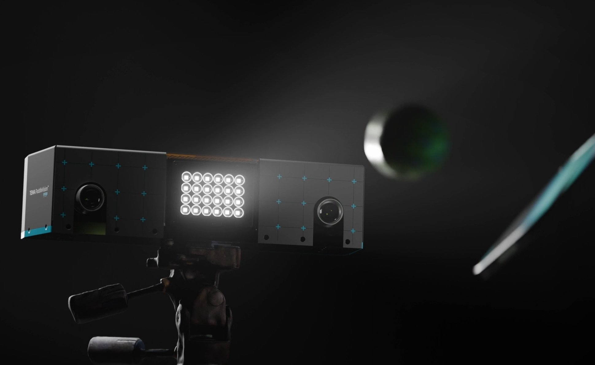 PaddleVision dual-camera system on a tripod, its two cameras and LED light panel capturing a pickleball as it rebounds off a paddle